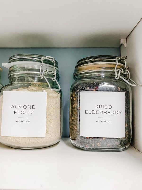 glass lidded jars with Etsy stickers to identify the content