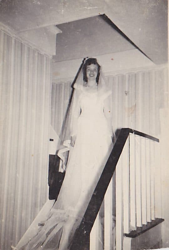 My Mom on the stairs in her parents farmhouse