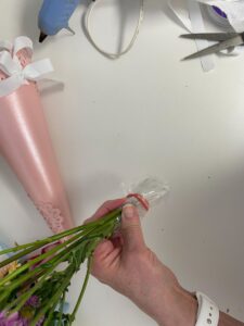 wrapping the stems of the flowers for a May Day basket