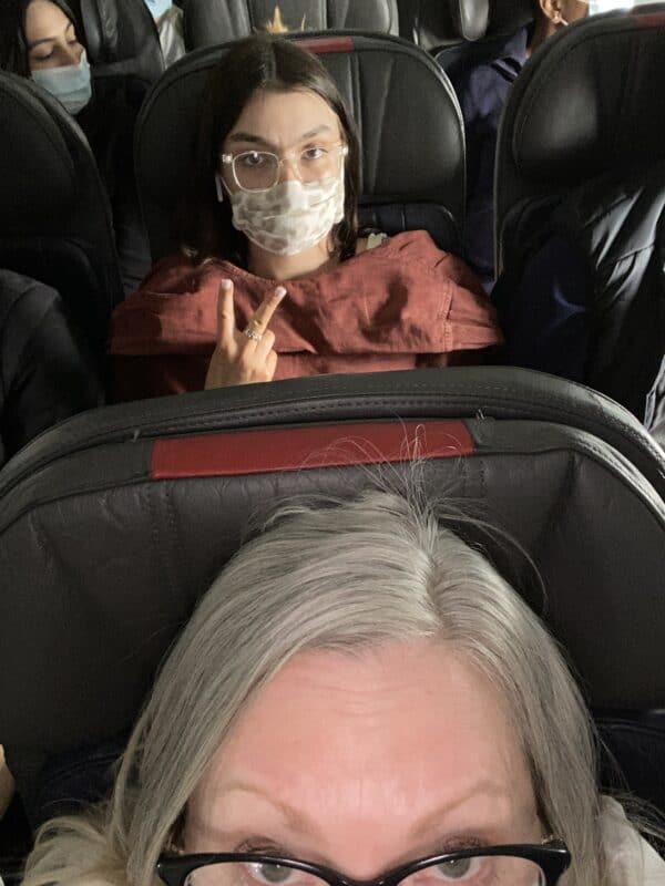 Emma sitting behind me in the airplane