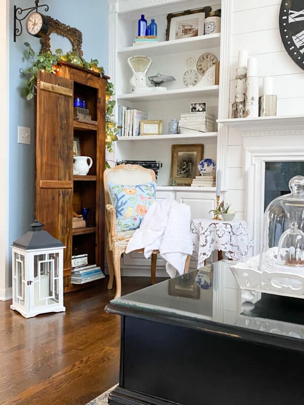 Picture of the corner of our family room book shelves filled with vintage decor