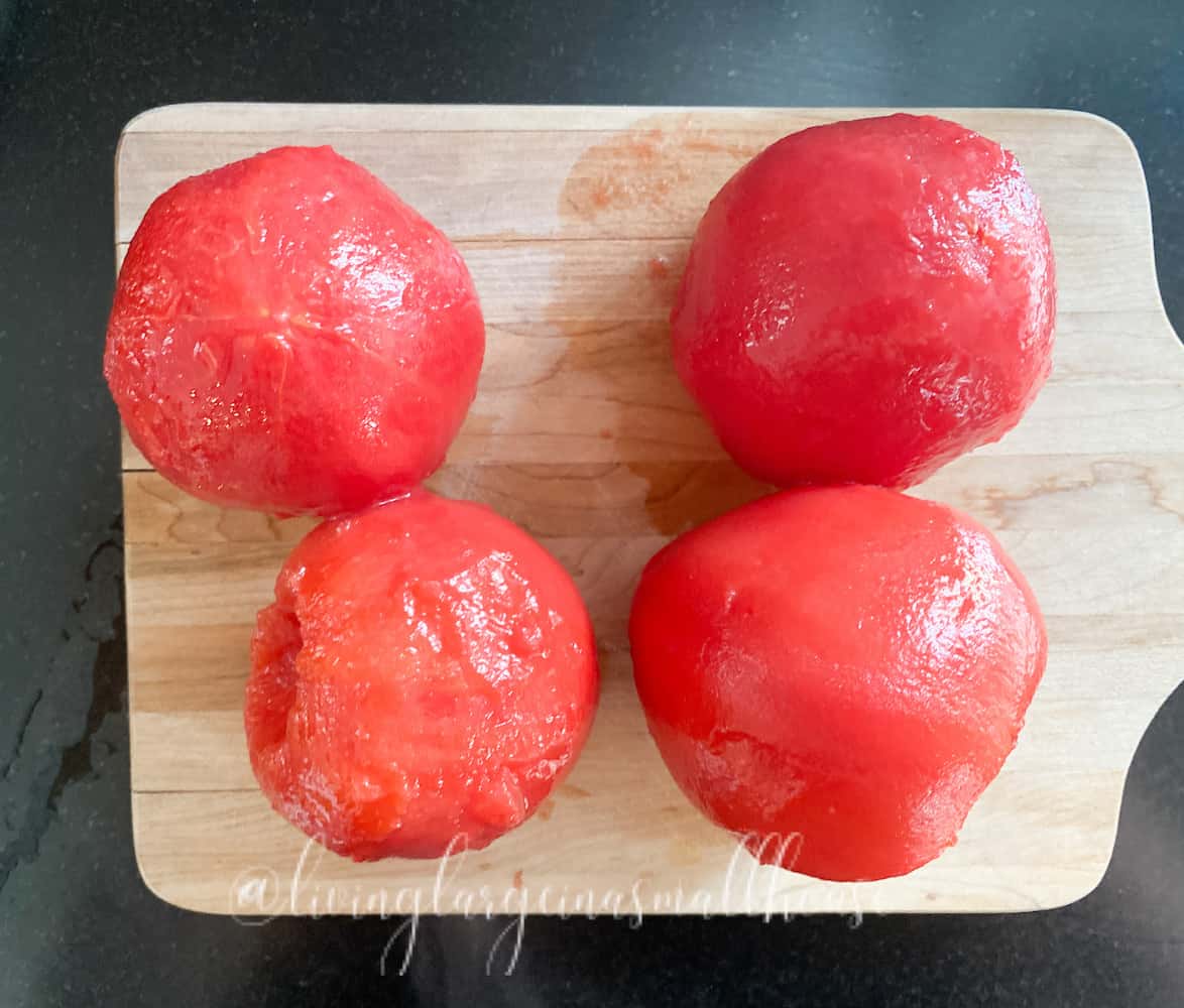 tomatoes without skin after blanching on cutting board
