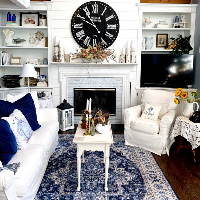 Farmhouse living room with simple DIY peel and stick white brick on fireplace surround makeover
