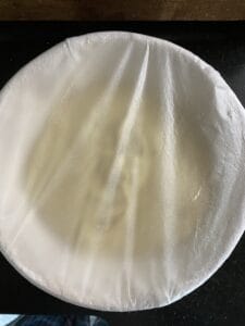 Dough proofing with plastic wrap in between lifts and folds