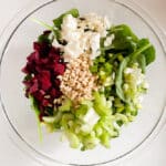 ingedients for beet salad in glass bowl