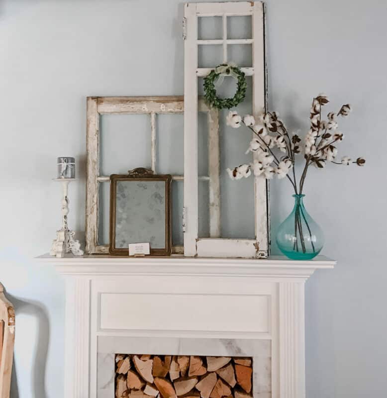 White Faux Fireplace mantel made by handy husband with vintage decor on top of mantel