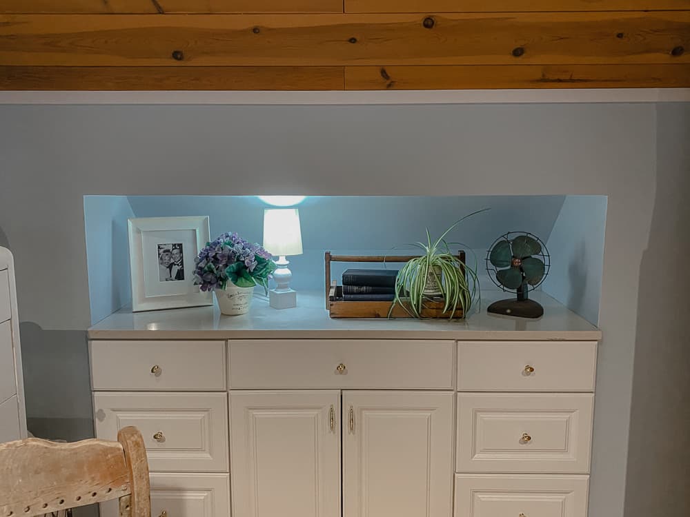 white dresser built into the eaves of a room by handy husband for more storage space