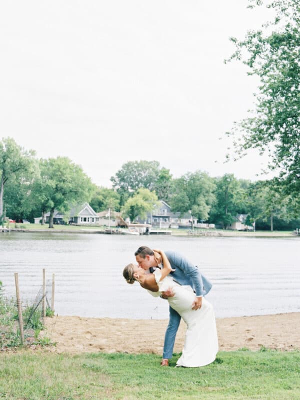 Annie and Tommy kissing on the beach