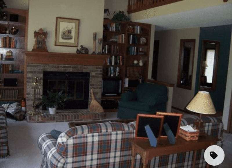 picture of an 80's family room with dark wood, red brick fireplace and blue, green, red and white plaid sofa to show my design style in the 80's