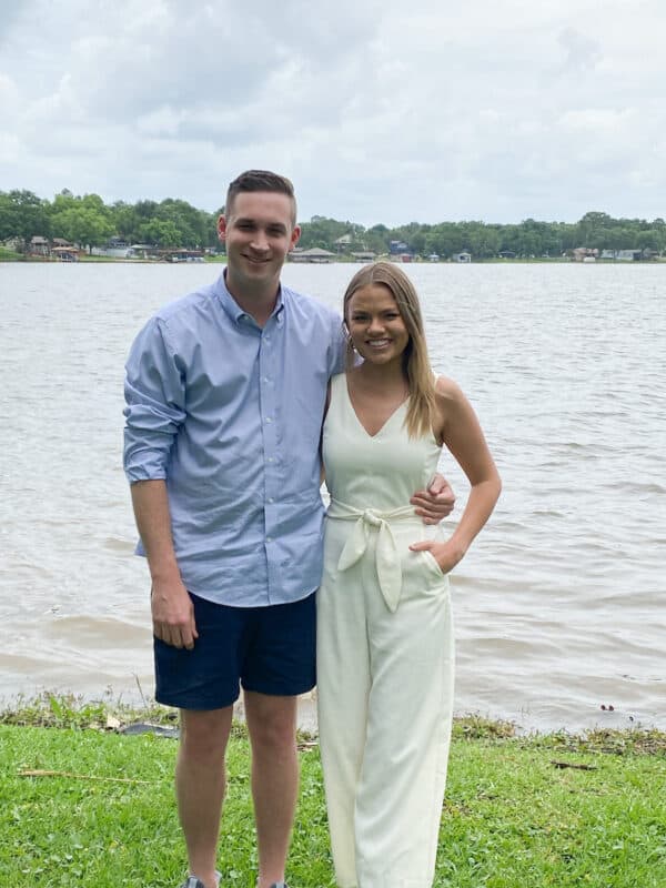 Annie and Tommy standing by the water in our Airbnb rented for their shower