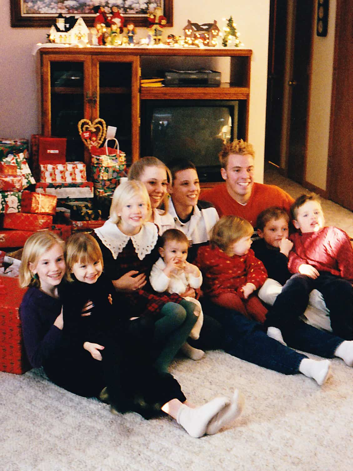 Christmas Eve with our kids sitting in front of the tree