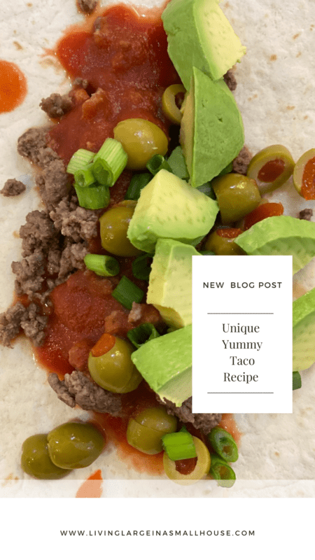 Pinterest pin with overlay that says "New Blog Post - Unique Yummy Taco Recipe" with a picture of a flour tortilla shell topped with browned ground beef, tomato sauce, chopped green onion, sliced green onion and diced avocado