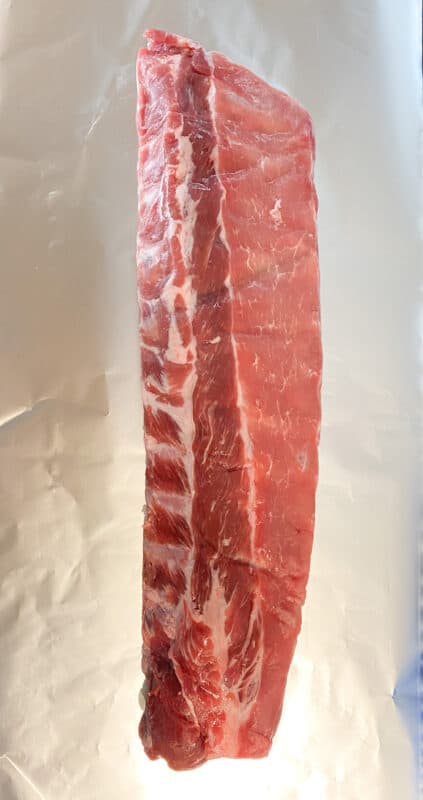 slab of baby back ribs on a piece of foil