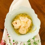 Easy Shrimp Alfredo with Angel Hair Pasta in a bowl on a floral napkin on the table