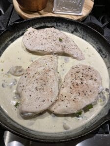 after the sauce has thickened and the chicken breast have been added back to the pan, it is ready to be served