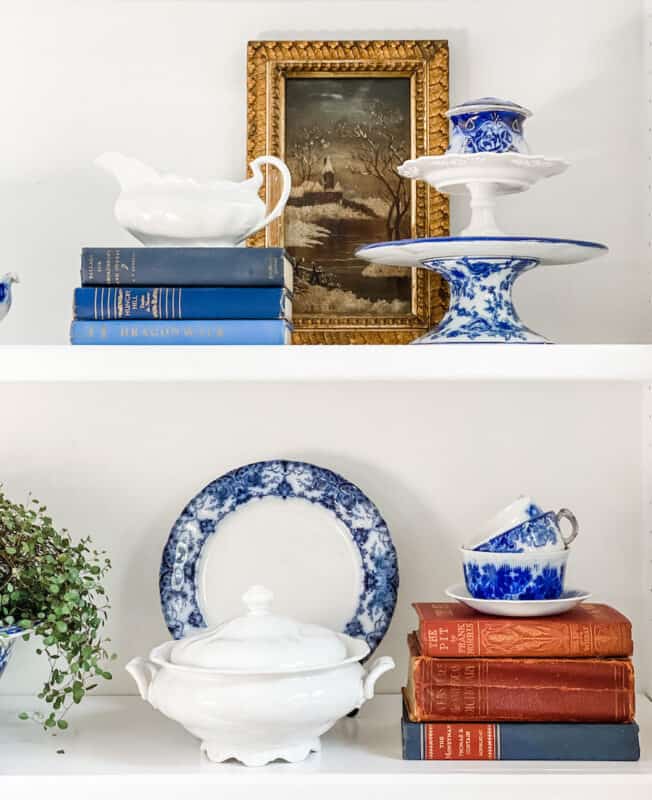 shelves with blue and white china and blue and red vintage books which are perfect if you are looking for some simple patriotic holiday decor ideas?