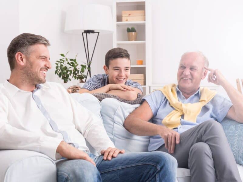 Dad's sitting around chatting on Father's Day waiting to open their Father's Day gifts