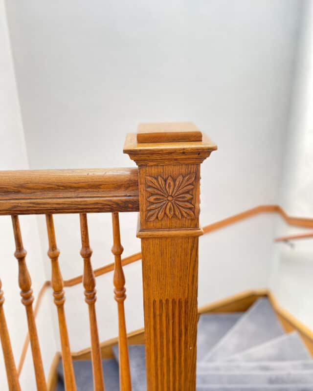 a vintage newel post in the apartment building that our baby Emma moved into