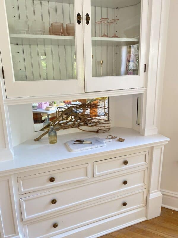 built-in white corner cabinet in a old apartment in Chicago