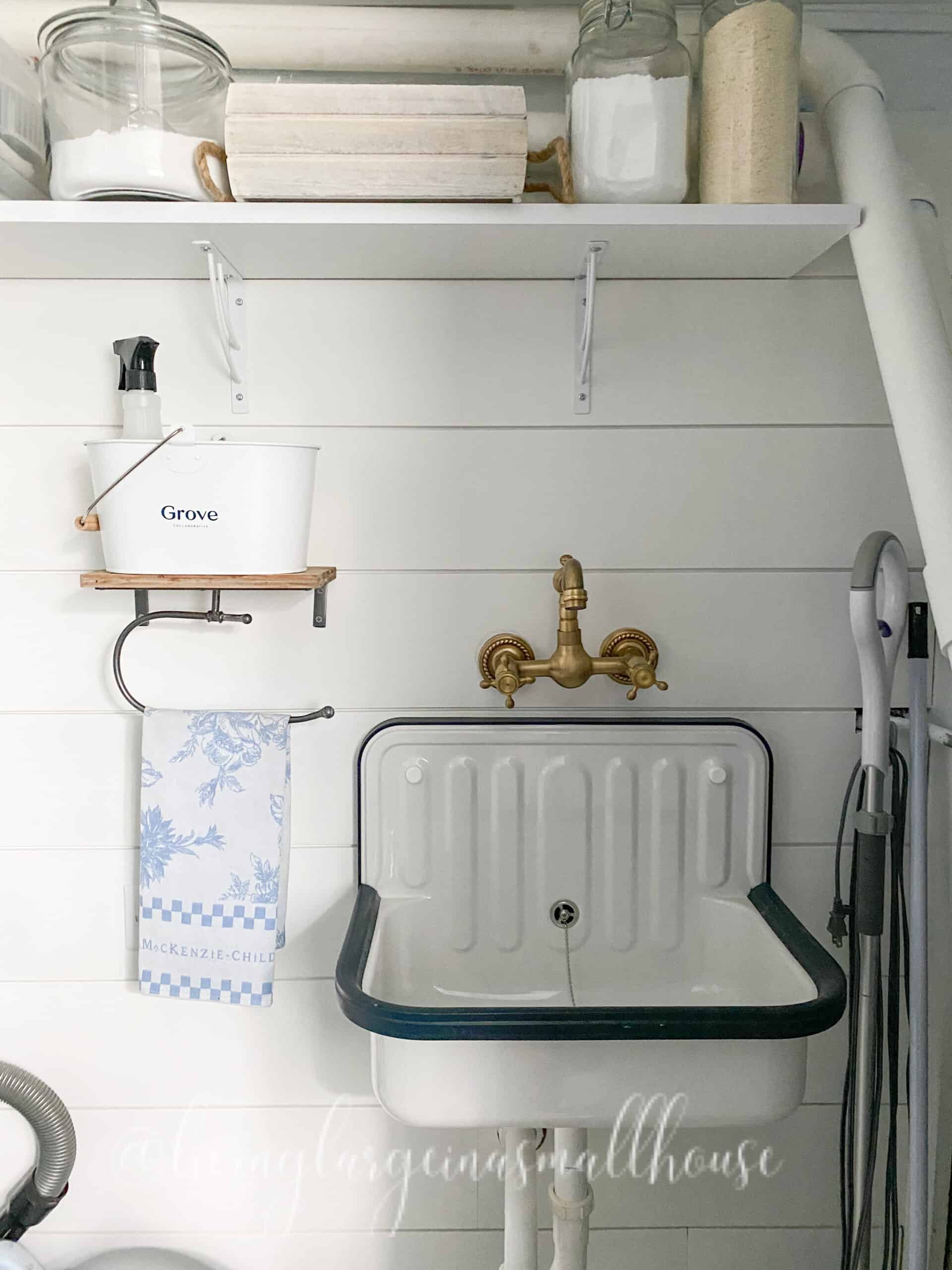 the farmhouse utility sink in the closet