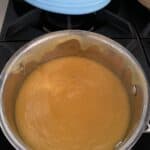 simple peach syrup in small saucepan