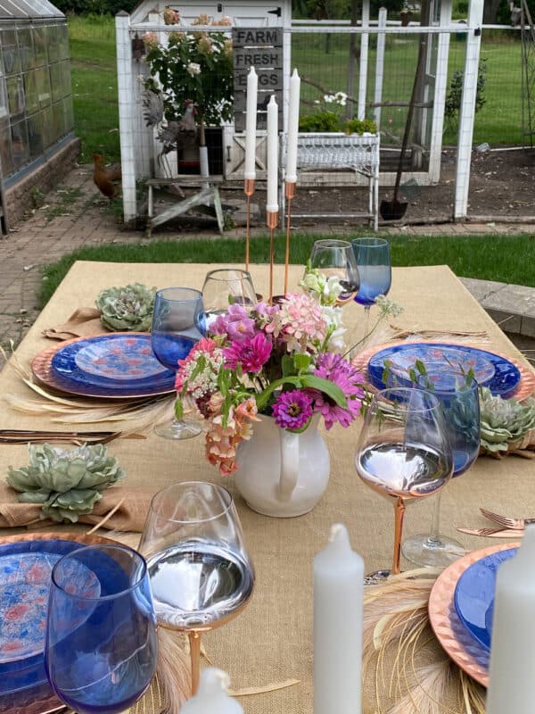 view of the tablescape set with the decoupaged napkins on glass plates settings