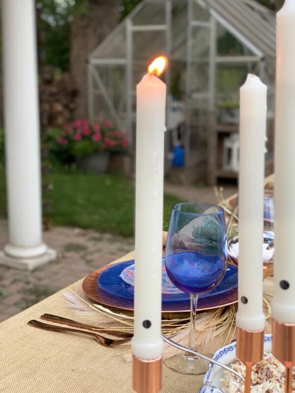 portrait mode photo of a colonial candle on tablescape