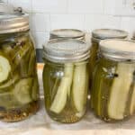 jars of processed crispy dill pickles