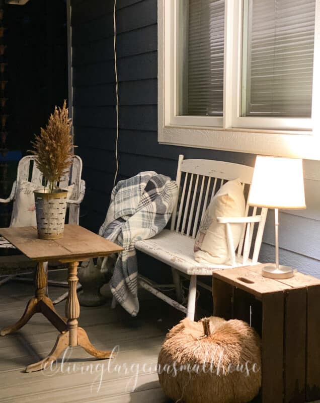 my fall front porch at night. Adding a lamp is a very simple front porch decor idea