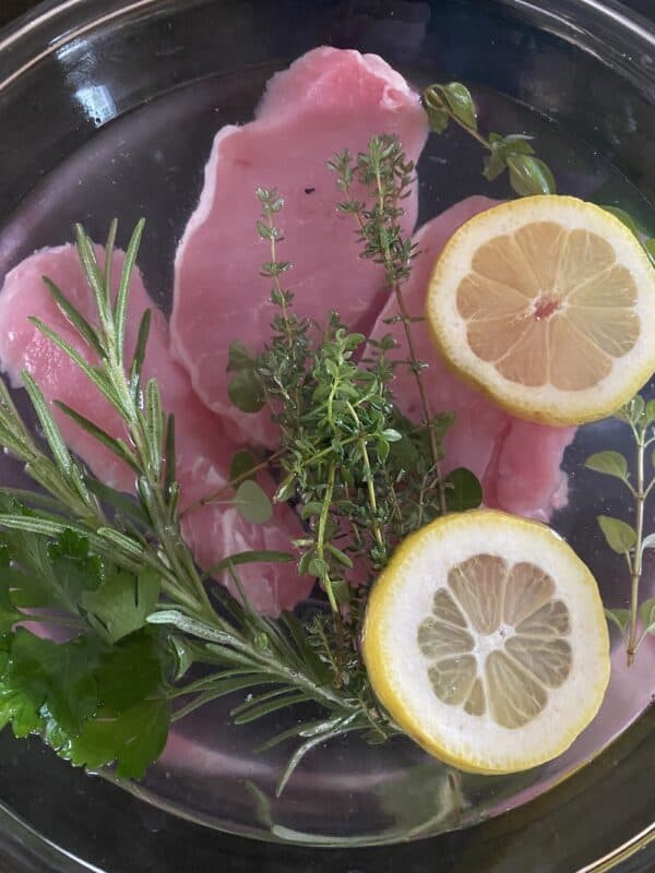 pork chops in brine mixture