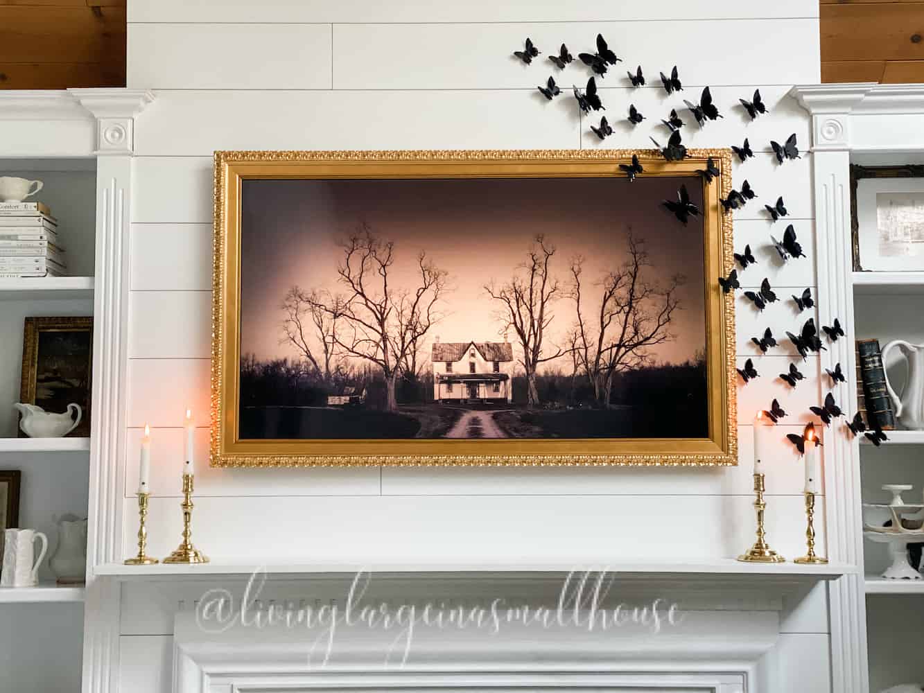 close-up of my frame tv with halloween art from Etsy and black butterflies from Amazon