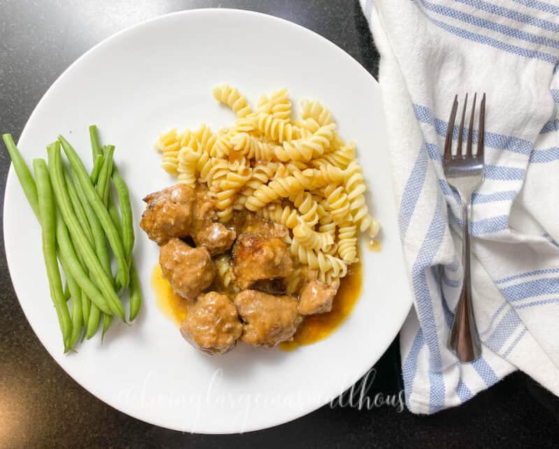 swedish meatballs with noodles and beans plated for dinner