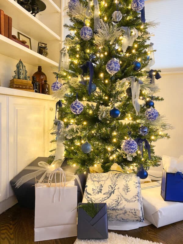 gifts in blue and white Kraft paper and also a gift wrapped in my toilé wallpaper