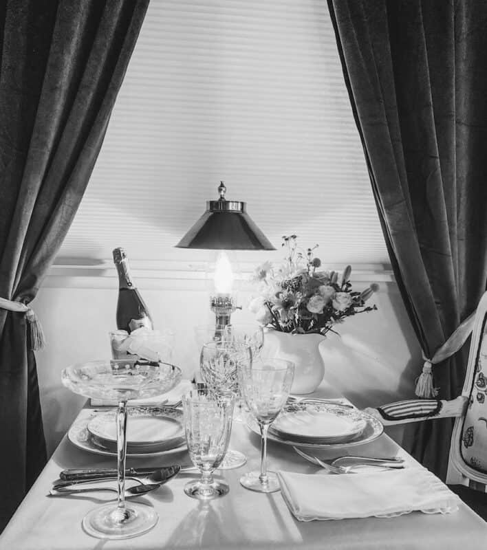 a black and white photo of my version of the dining car on the orient express