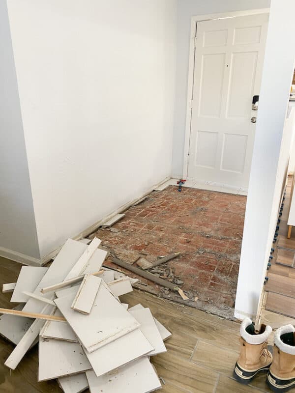 red brick flooring under flipper tile