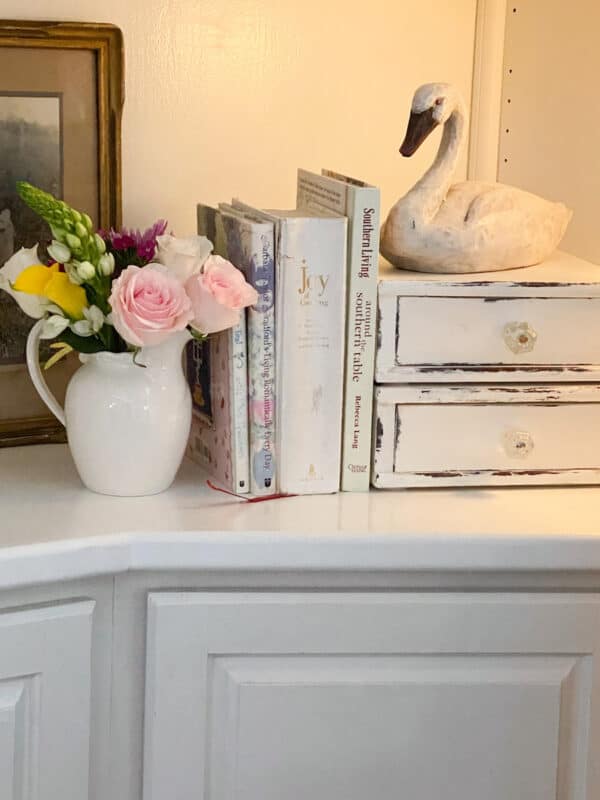 a white ironstone pitcher with a sweet pink bouquet of flowers for simple, subtle, and elegant Valentine's Day decor