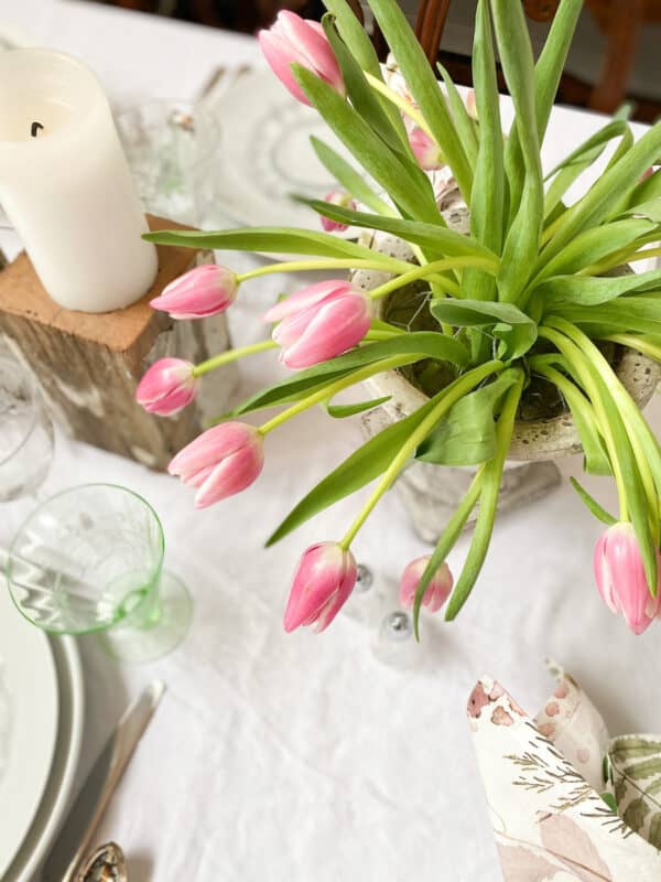 a overhead view of pink tulips on a Valentine's Day tablescape