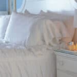 tranquil white bed and white bed linenes