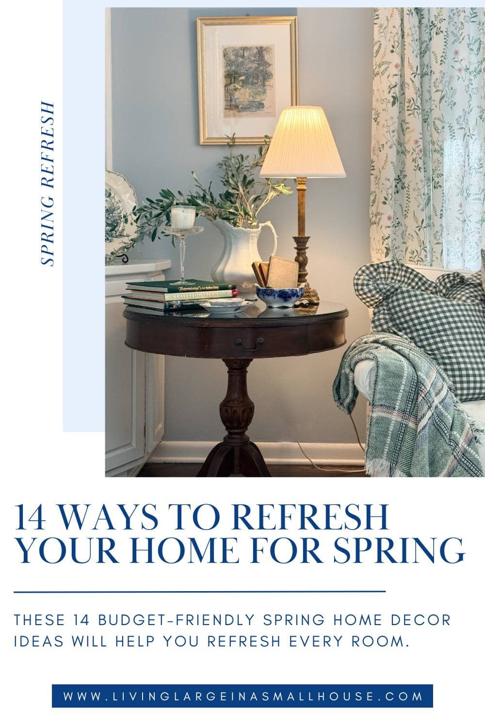 A cozy living room corner with a round wooden table holding a yellow lamp, blue vase with white flowers, and teacup. A green checkered armchair and floral curtains are beside the table—find inspiration for ways to refresh your home for spring.