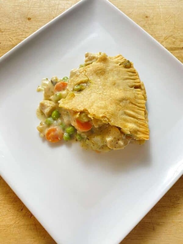 a slice of chicken pot pie with a beautiful golden crust.