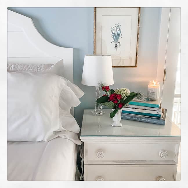 clean and organized end table in primary bedroom