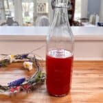 a flip top bottle with homemade raspberry cordial