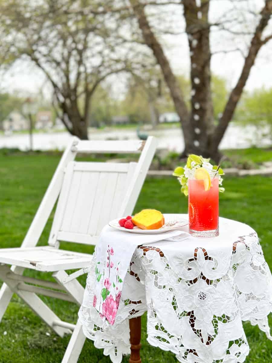 a table with raspberry cordial lemonade with lemon cake