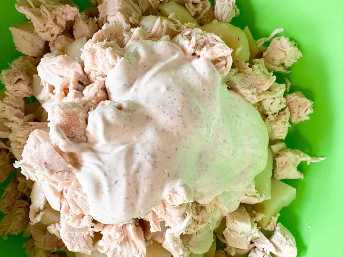 potatoes and chicken with creamy dressing on top