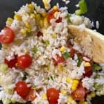lime rice with corn, tomatoes and green onions - different kinds of rice