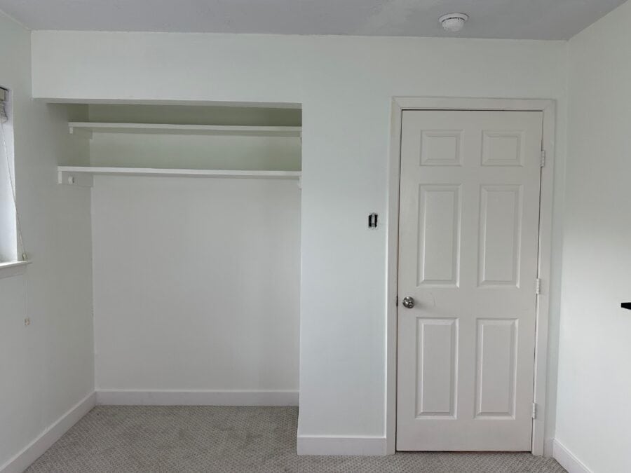 a photo of the blank closet wall in the baby nursery