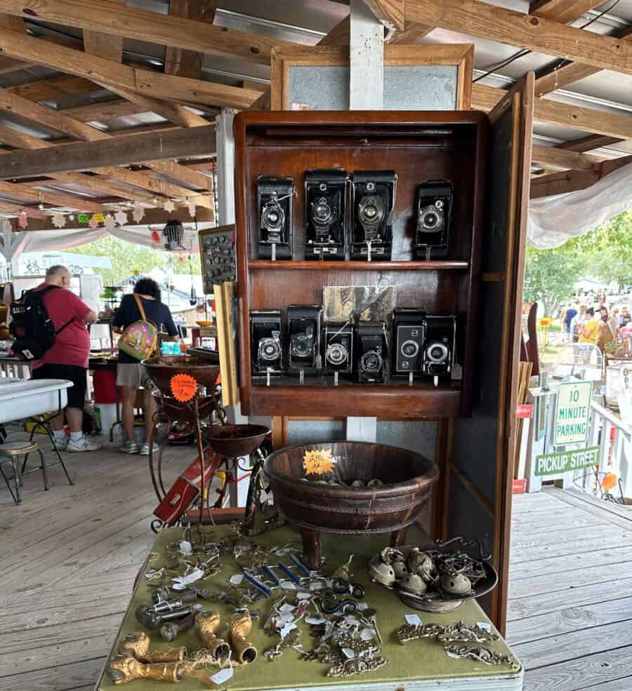 a miscellaneous vendor with vintage cameras in round top
