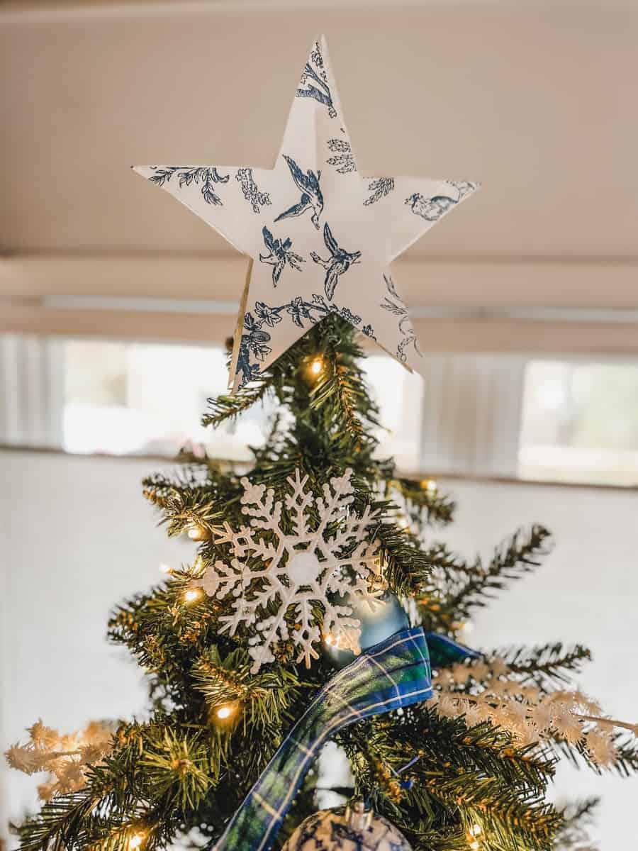 a paper star for the office christmas tree made from left over toile wallpaper