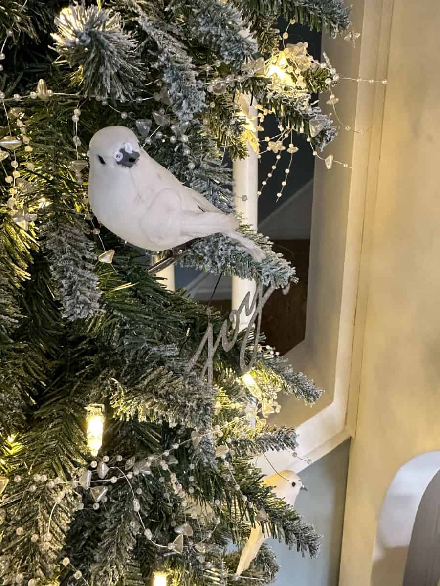 our entryway tree has white bird ornaments
