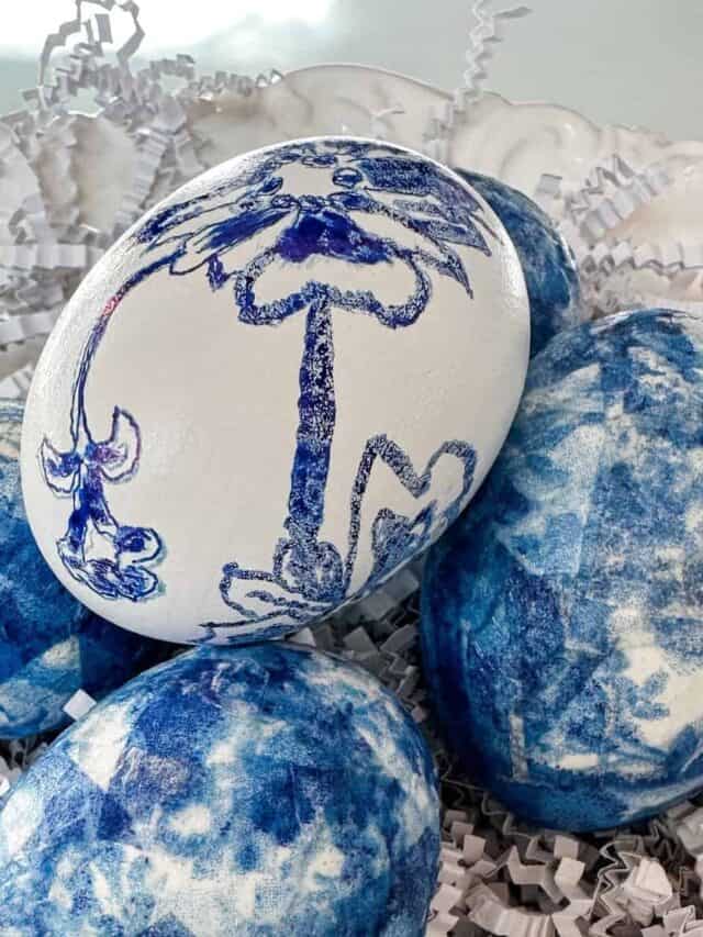 Upgrade your Easter decor on a budget! This easy DIY transforms eggs into stunning Pottery Barn-inspired beauties with blue and white napkins along with the egg that I made with a fine-tip marker